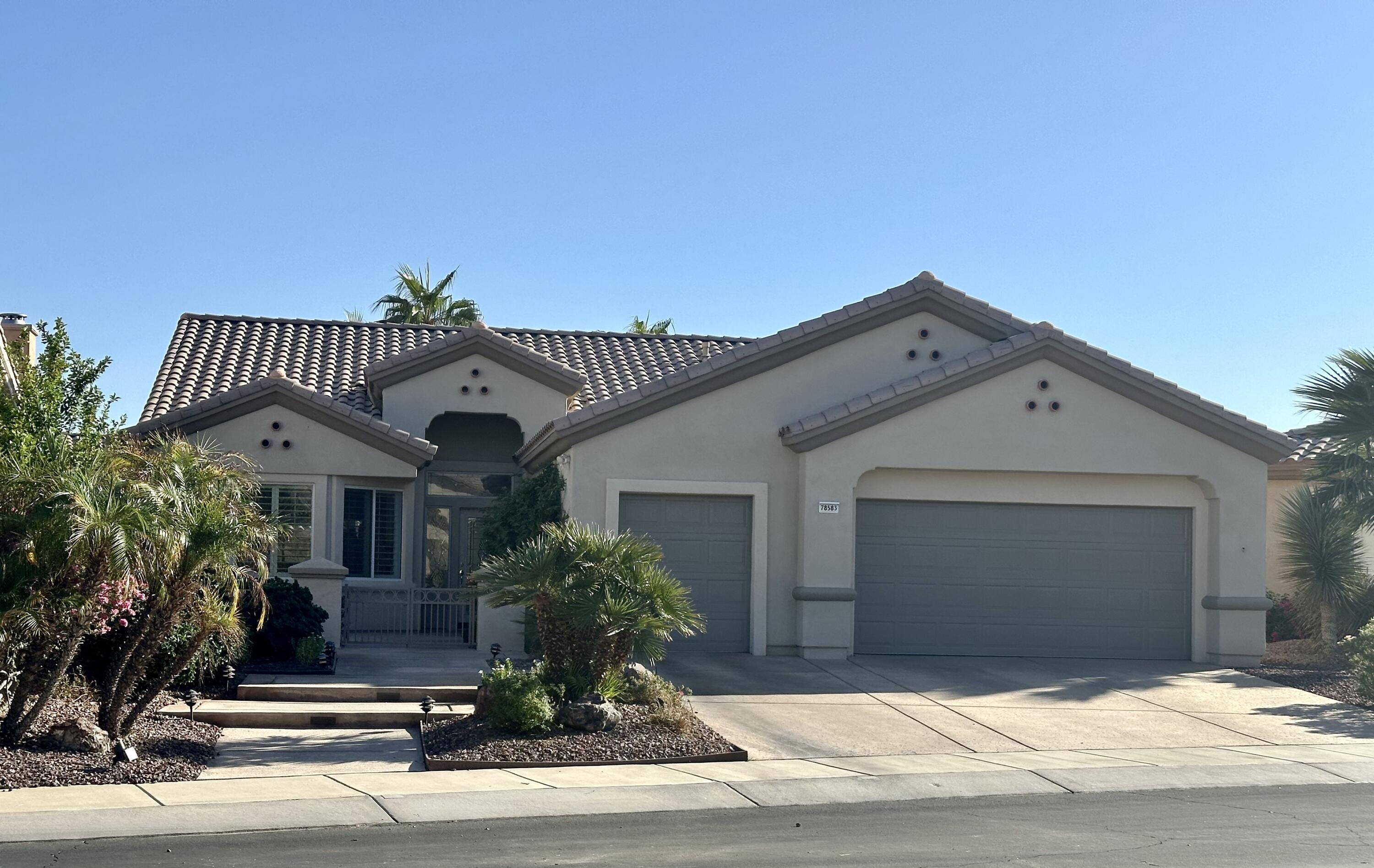 a front view of a house with a garage