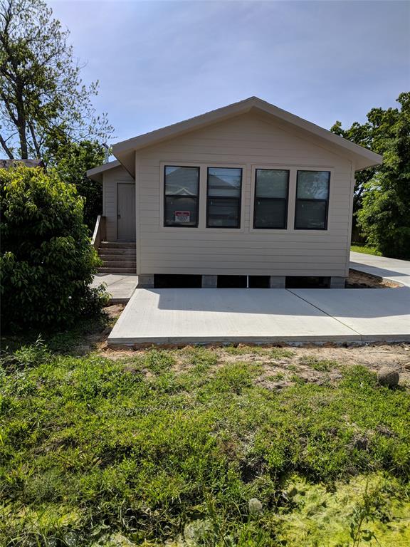 a house with trees in the background