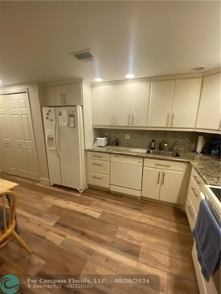 a view of a kitchen with a sink