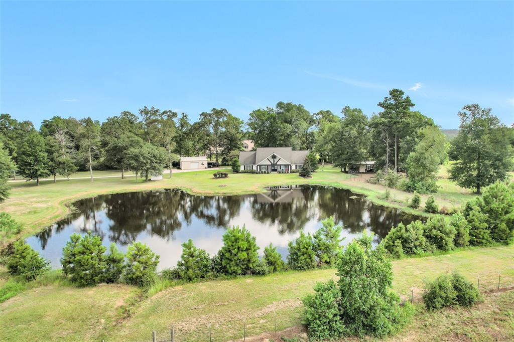 a view of a lake with houses in the back