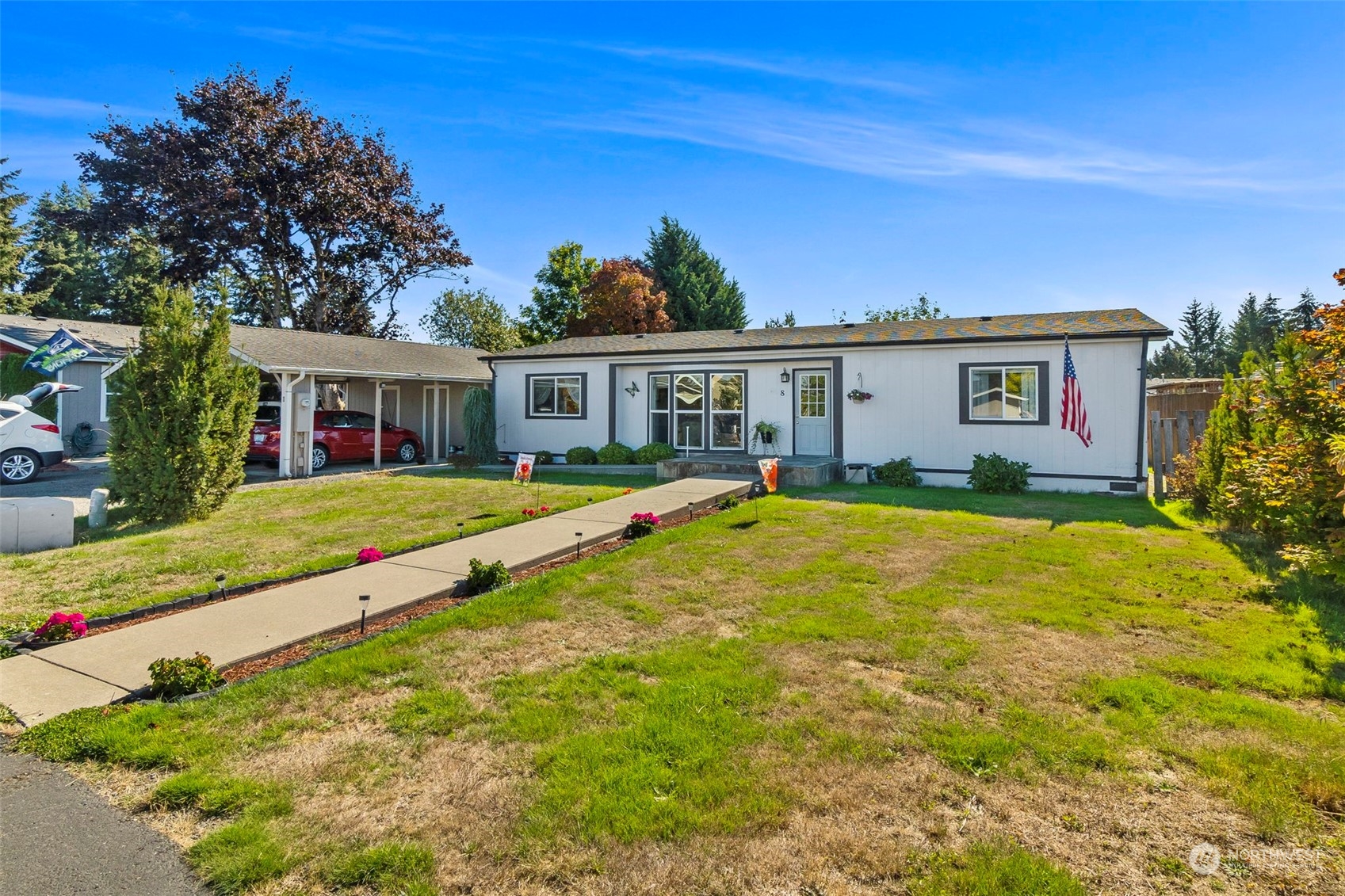 a view of house with a yard