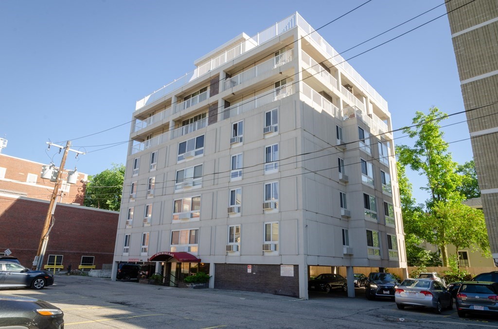 a view of building with parking space