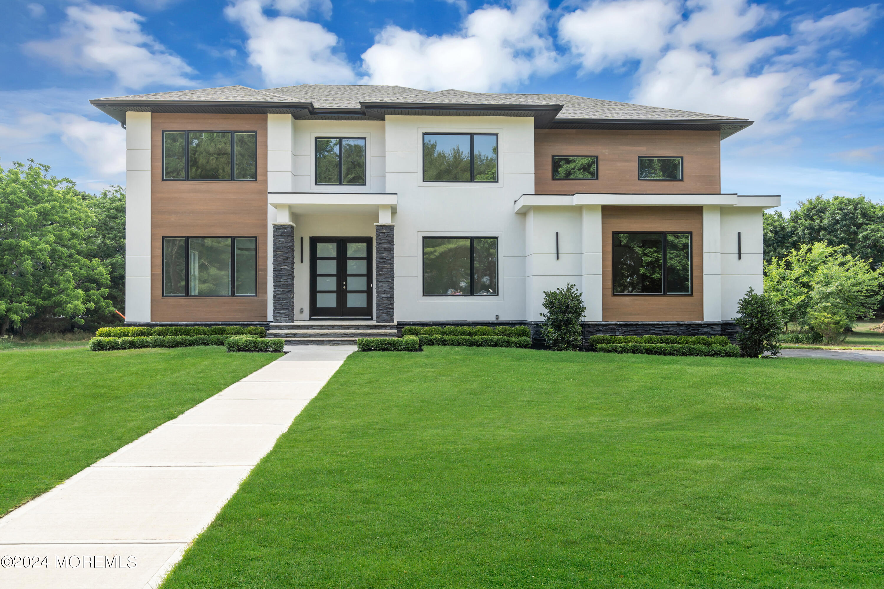 front view of a house with a yard