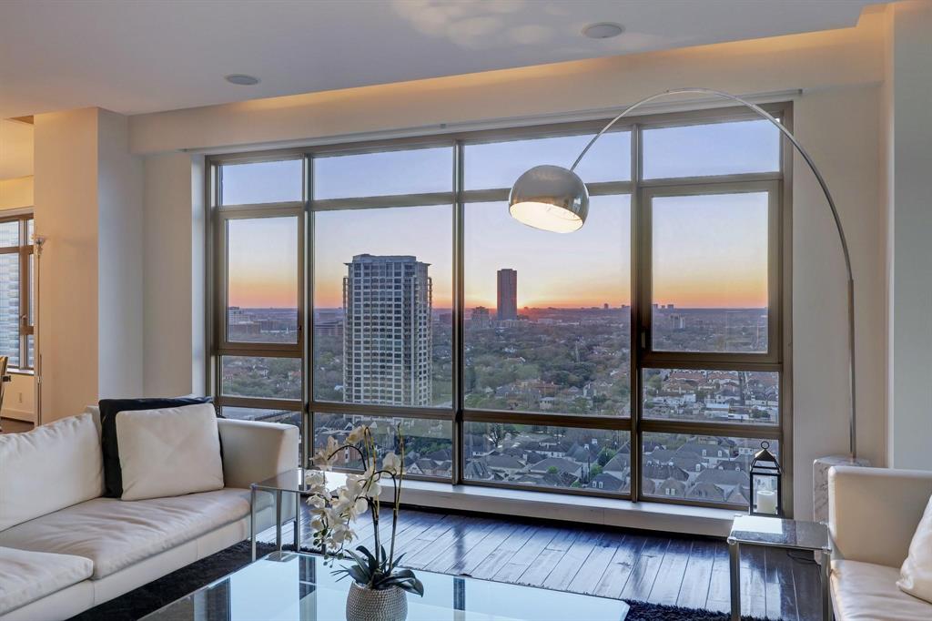 a view of a living room and a balcony