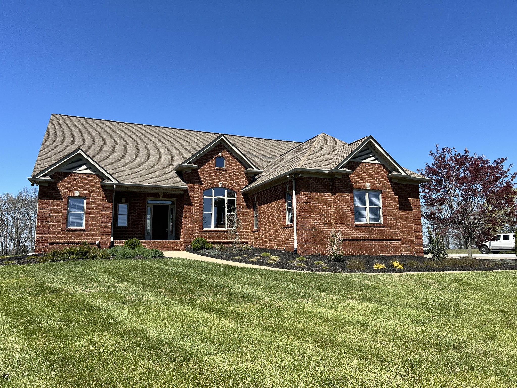 a front view of a house with a yard