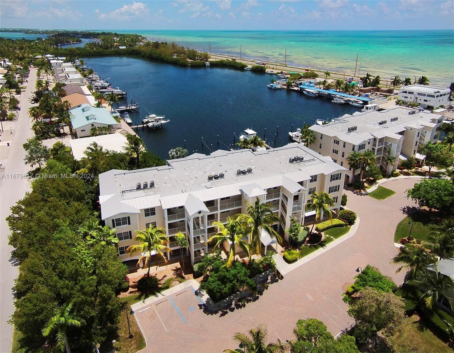 an aerial view of a building with an ocean view