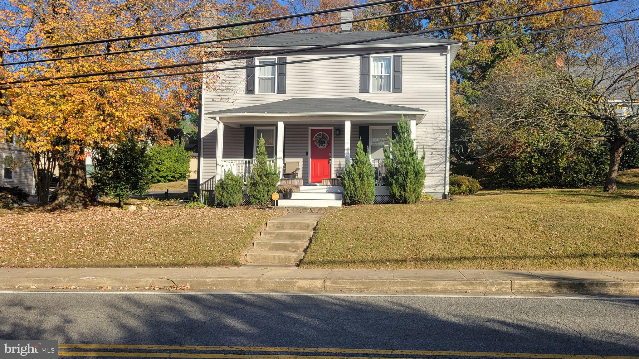 a view of a brick house with potted plants