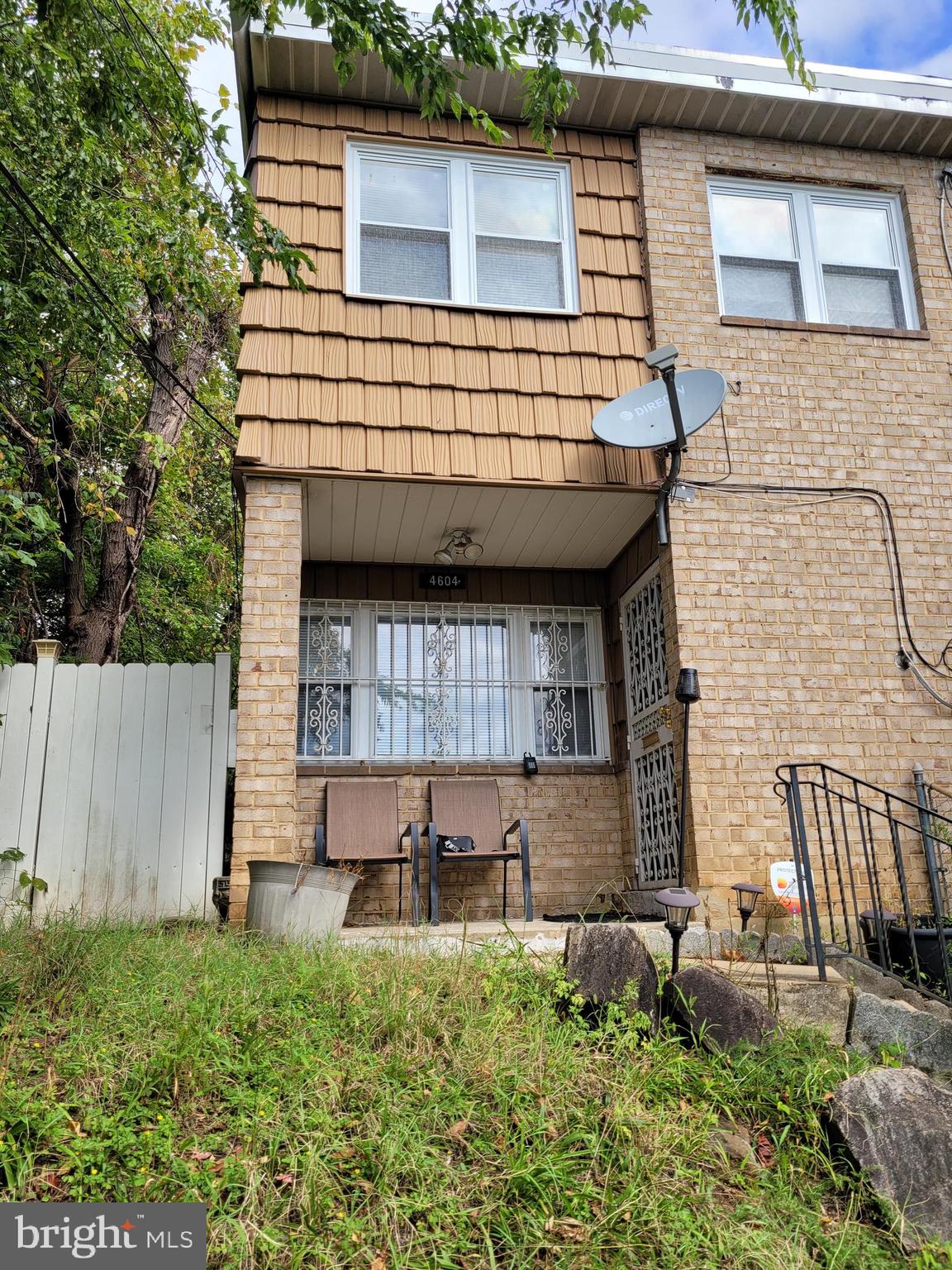 a view of a house with a small yard and plants