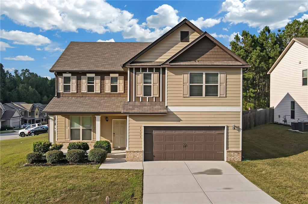 a front view of a house with a yard