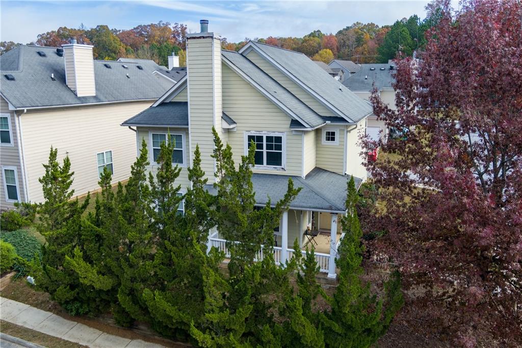 a aerial view of a house with a yard and plants