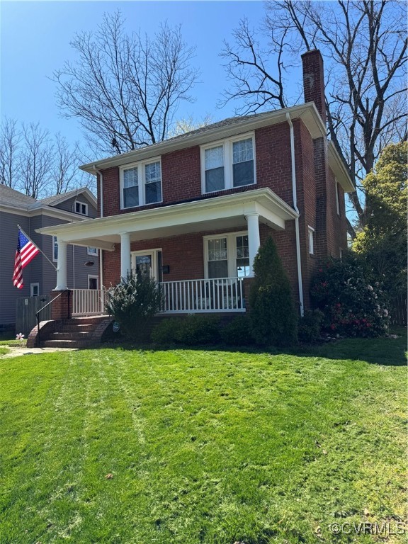 View of front of property with a front lawn