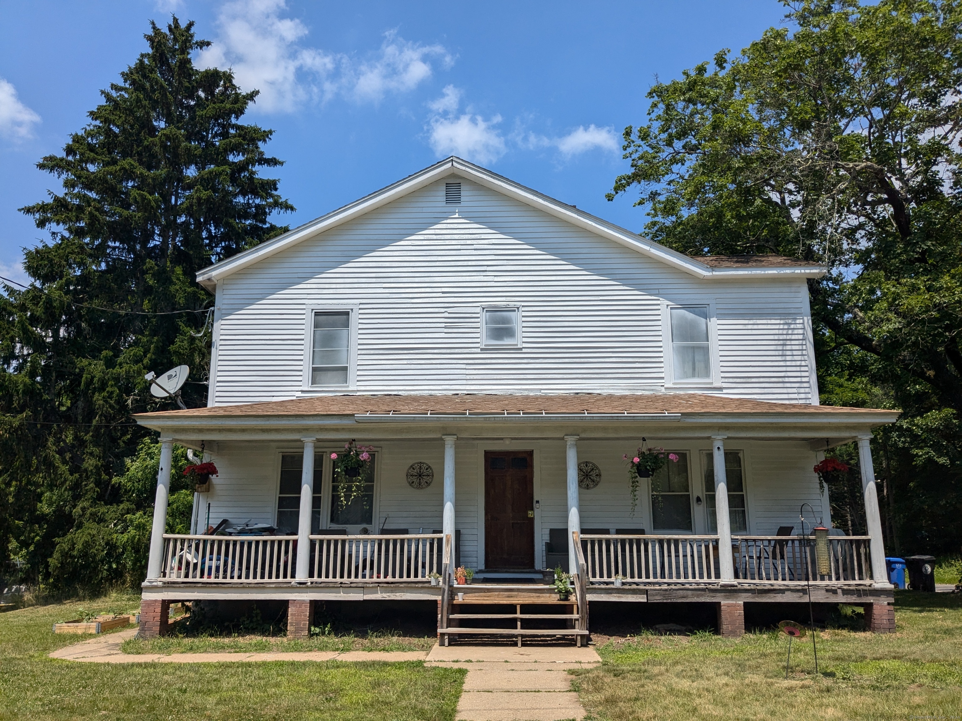 a view of a house with swimming pool and porch