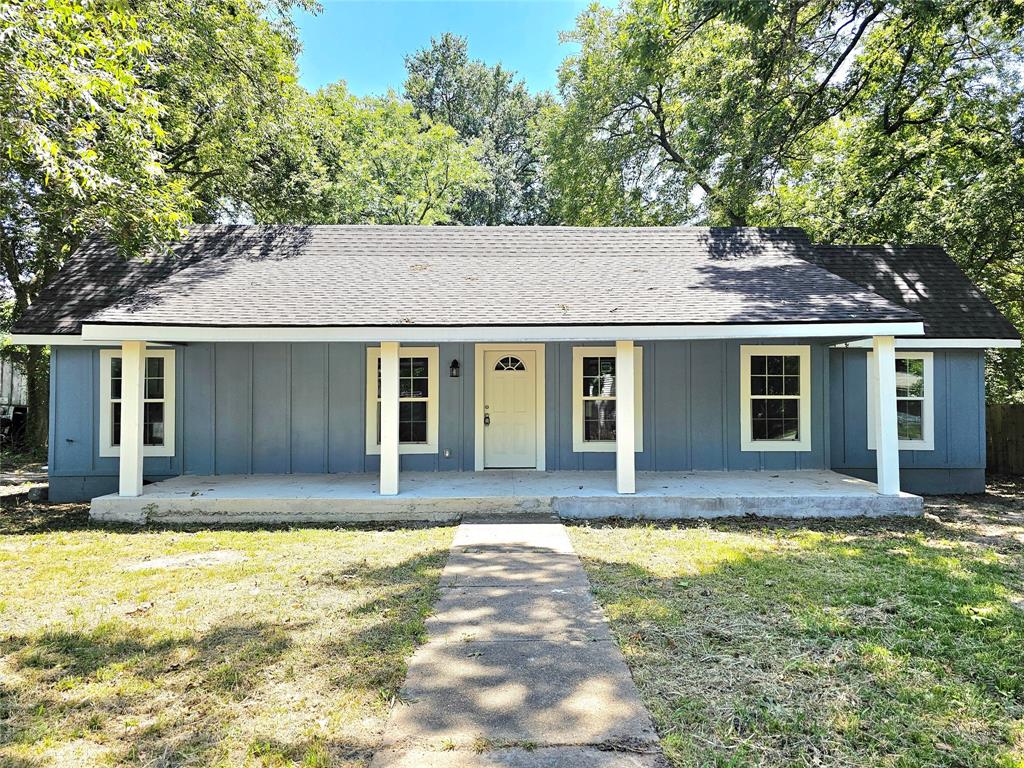 front view of a house with a yard