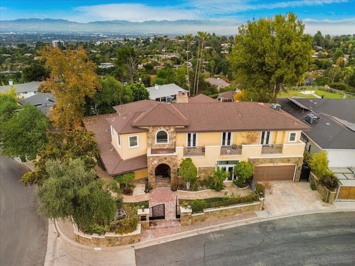 an aerial view of a house with a garden