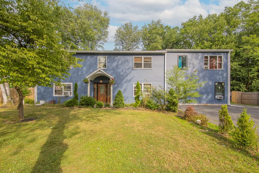 View of front of house with a front yard