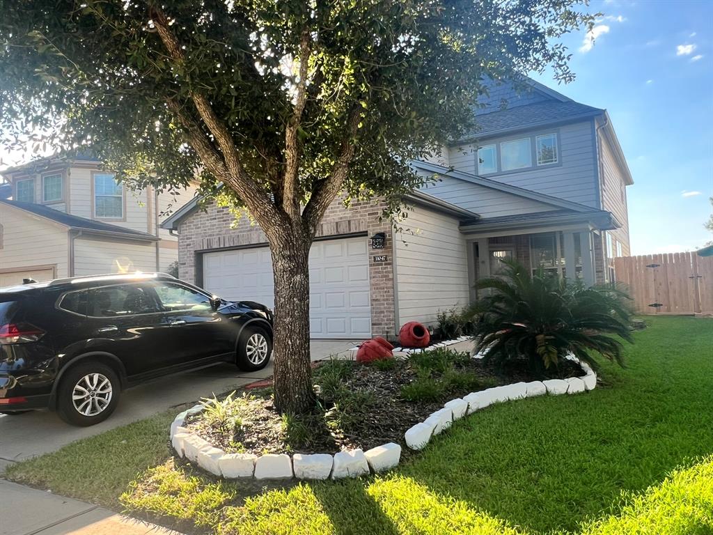 a house view with a garden space