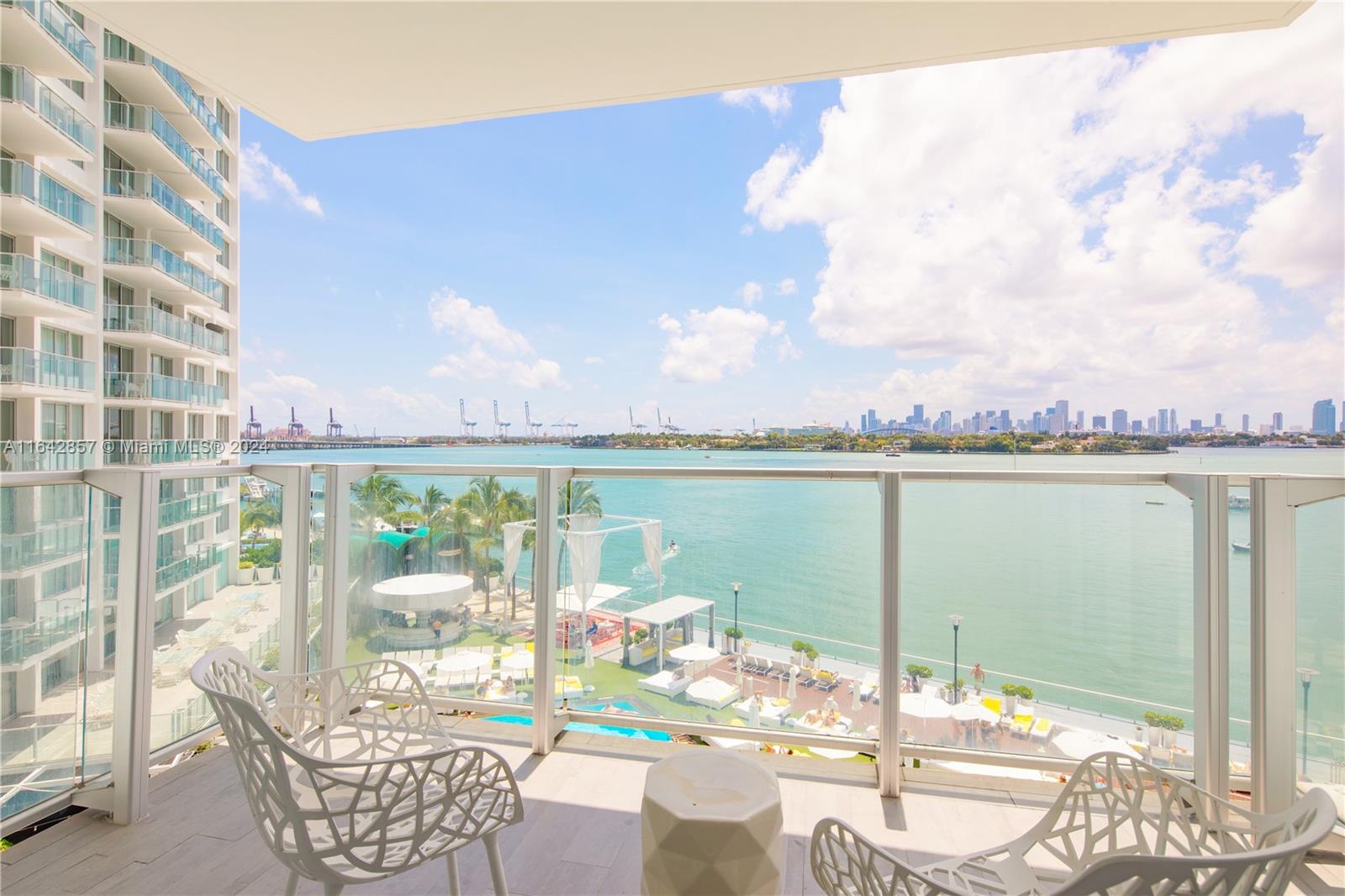 a view of a balcony with lake view and mountain view