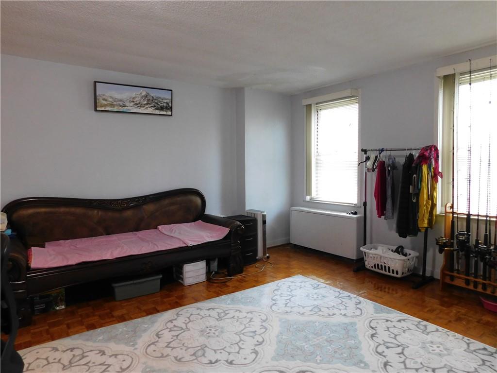 a bedroom with furniture and a window