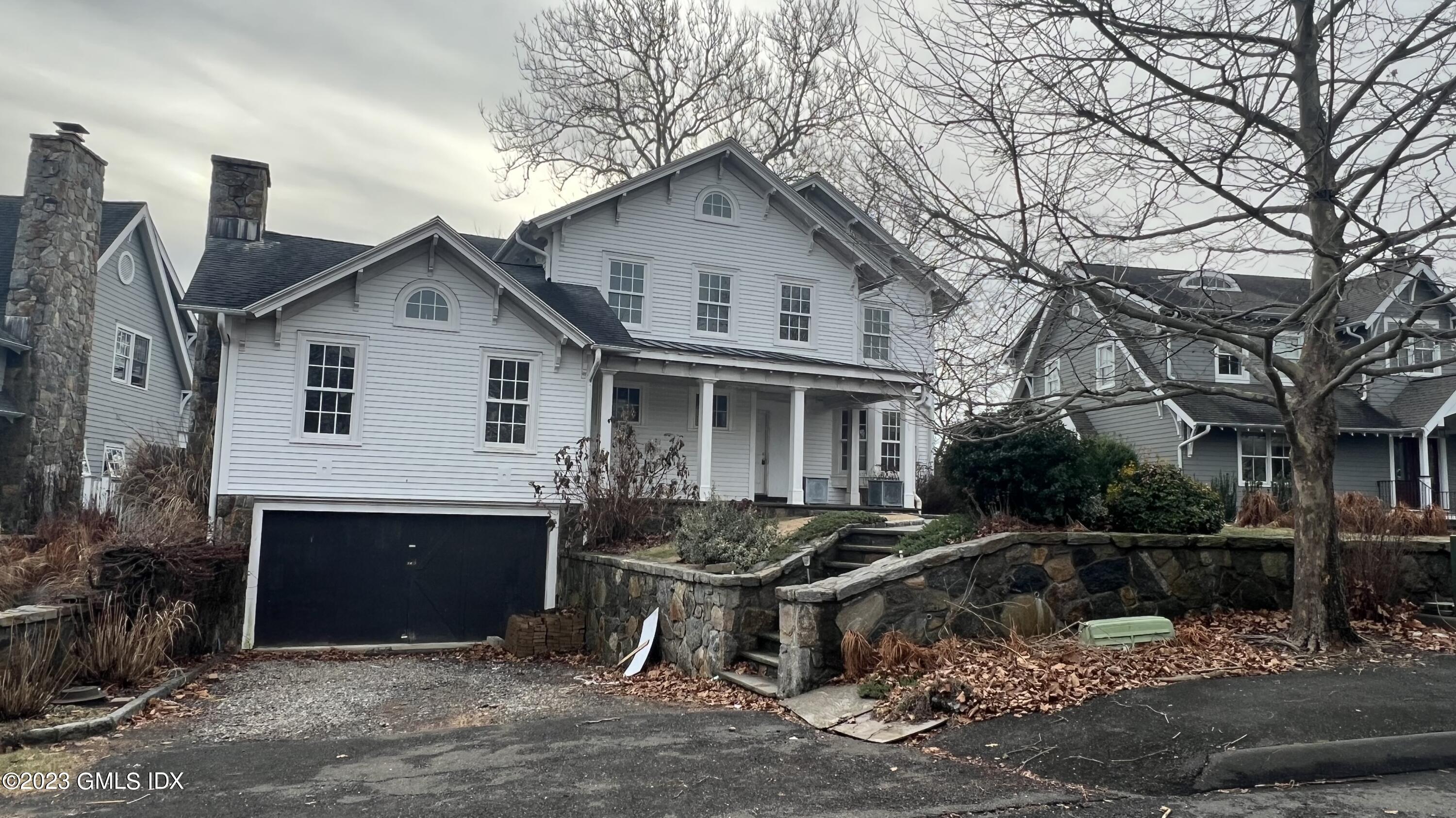 a front view of a house with garage