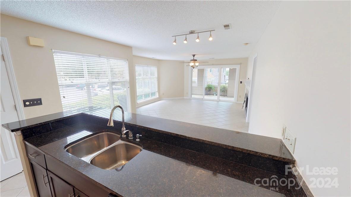 a kitchen with a sink and a window