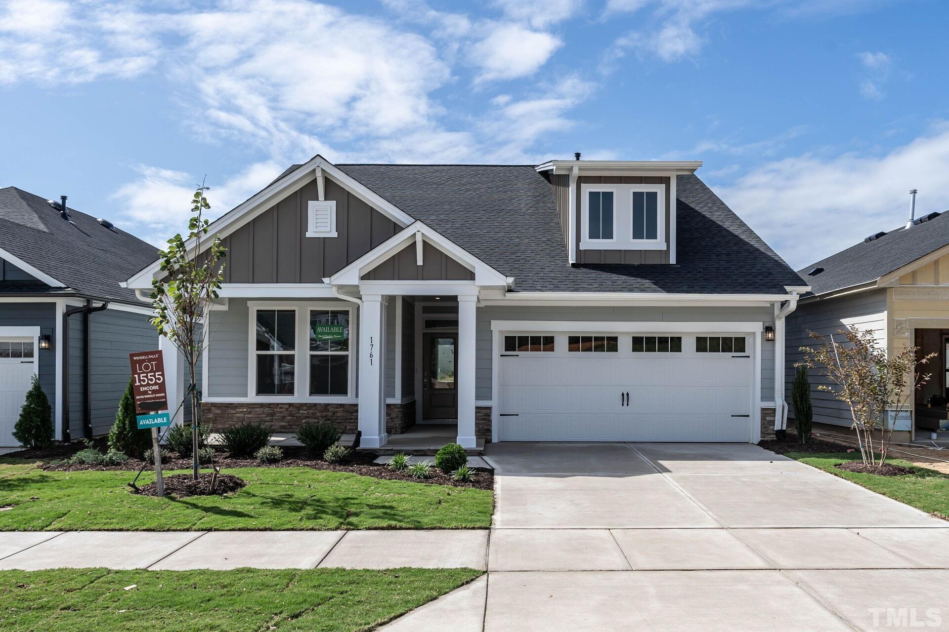 a view of house with yard