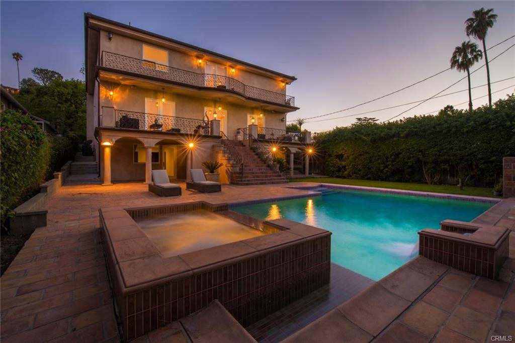 a view of a swimming pool with a patio