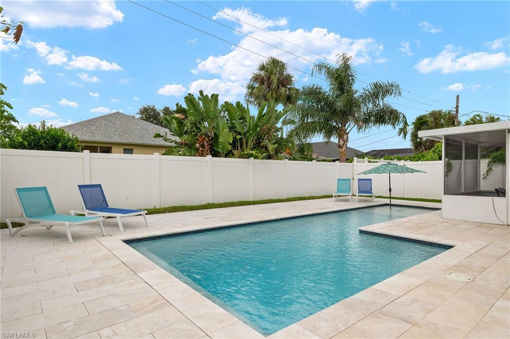 a view of swimming pool with lounge chair