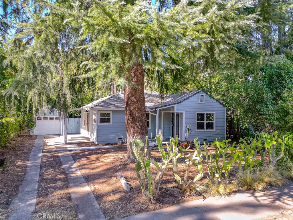 a house with trees in the background