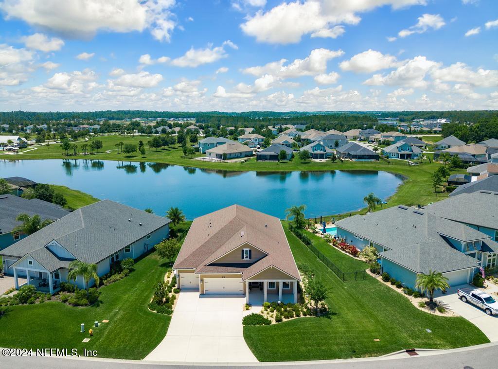 an aerial view of a house with lake view and mountain view