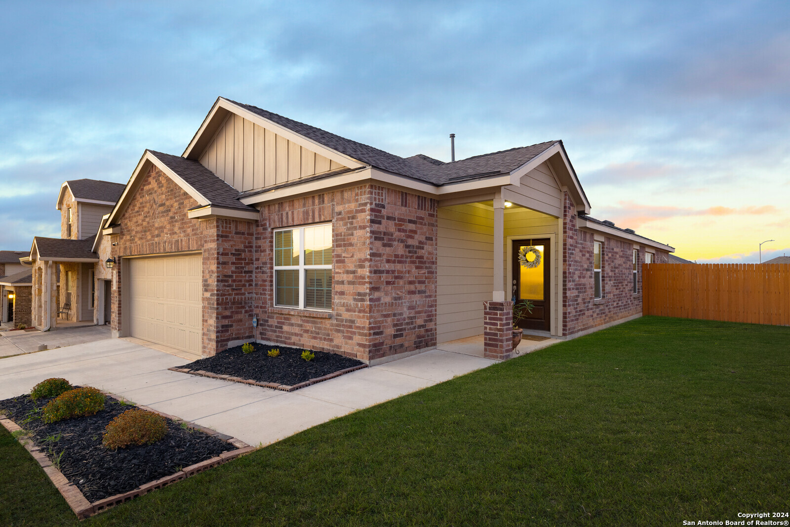 a front view of a house with garden