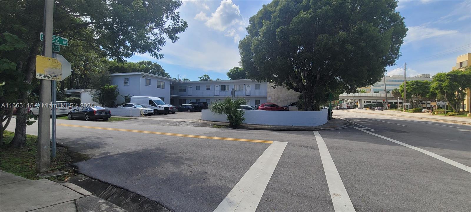 a view of street with parked cars