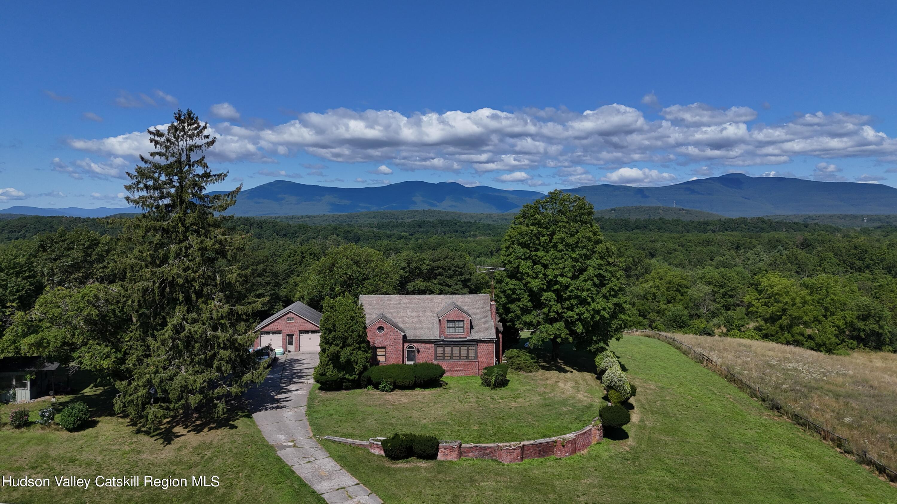 a view of a house with a big yard