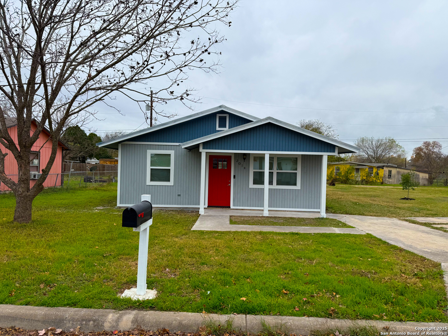 a front view of house with yard and green space