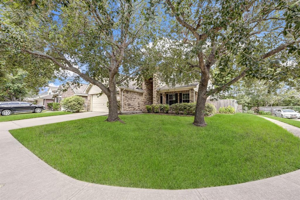 a view of a house with a backyard