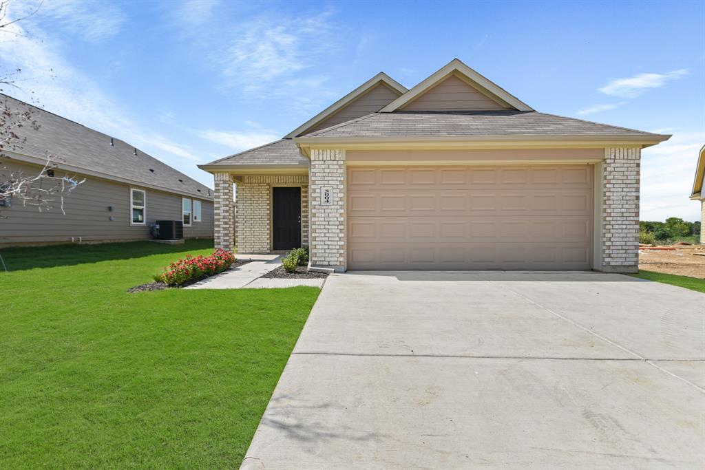 a front view of a house with yard