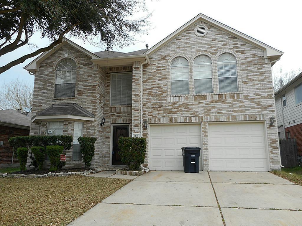 a front view of a house with yard