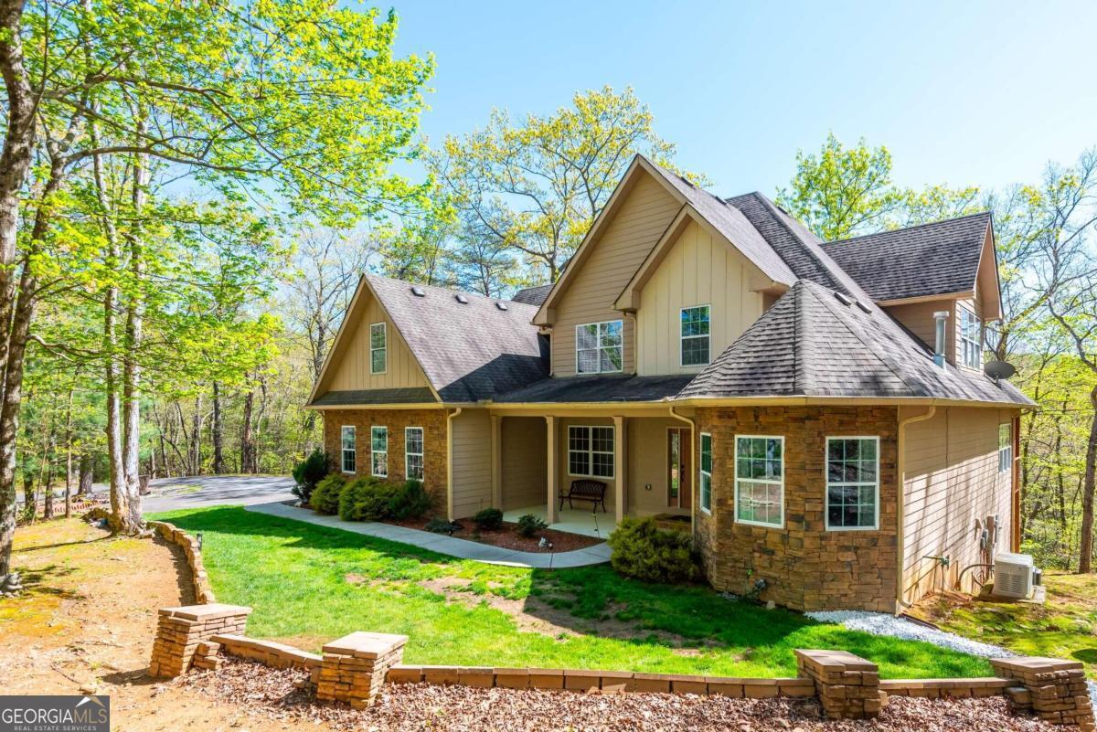 front view of a house with a yard