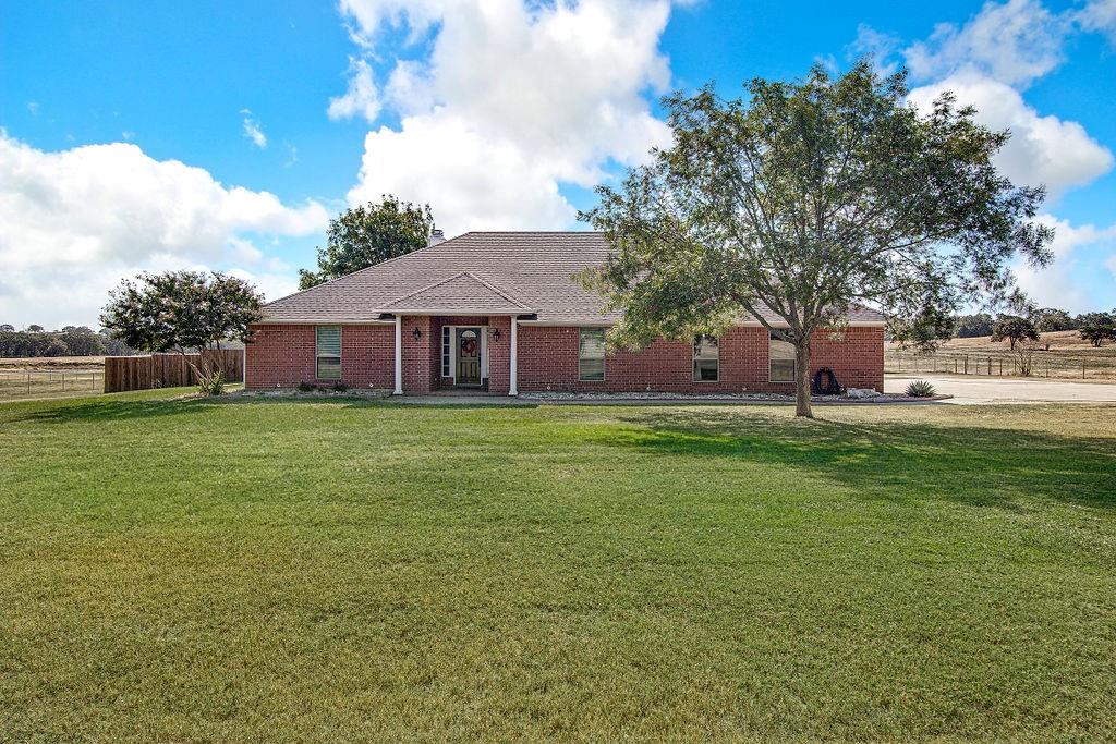 a view of a house with a big yard