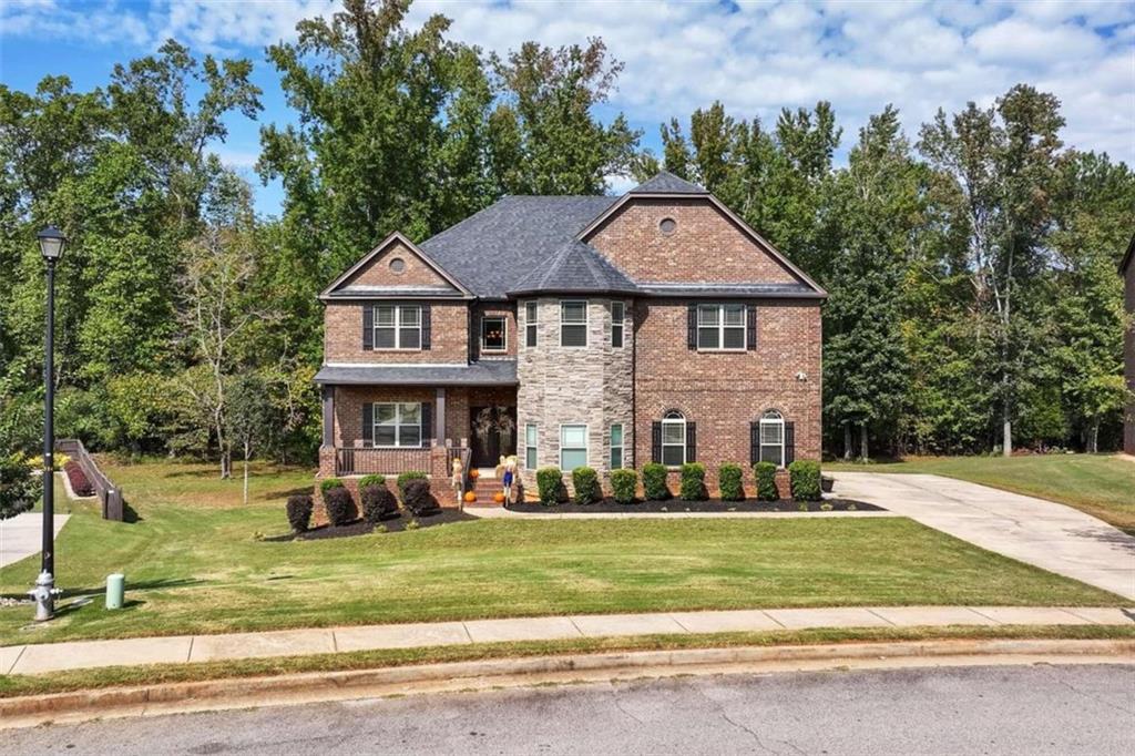 a front view of a house with a yard