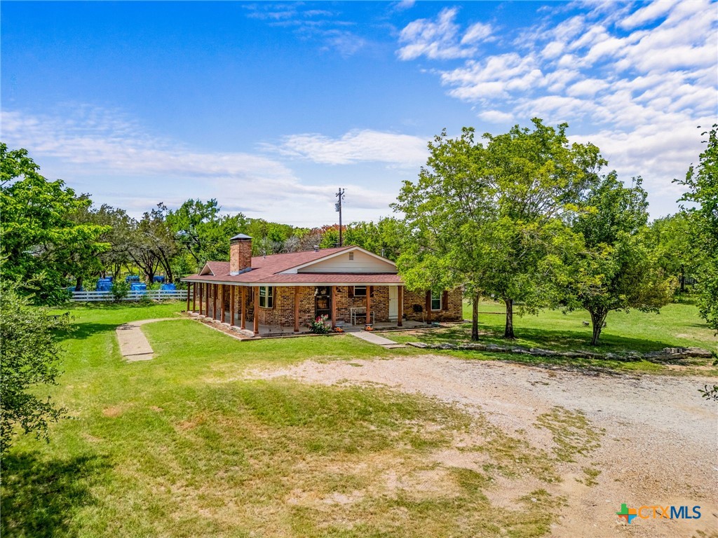 a view of a house with a big yard