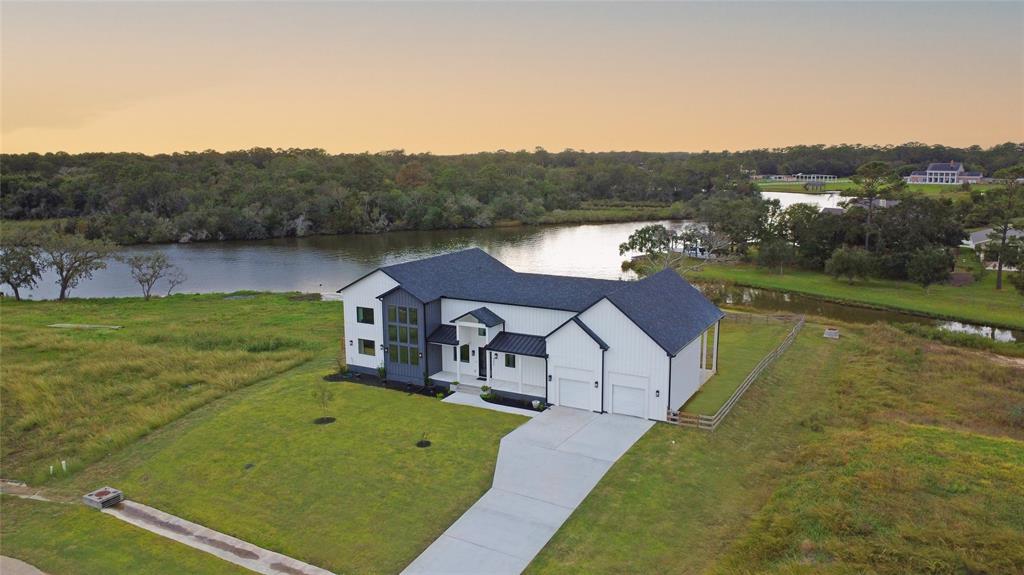 a view of a big house with a big yard