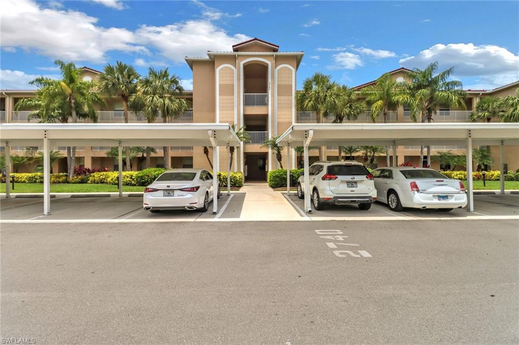 a couple of cars parked in front of building