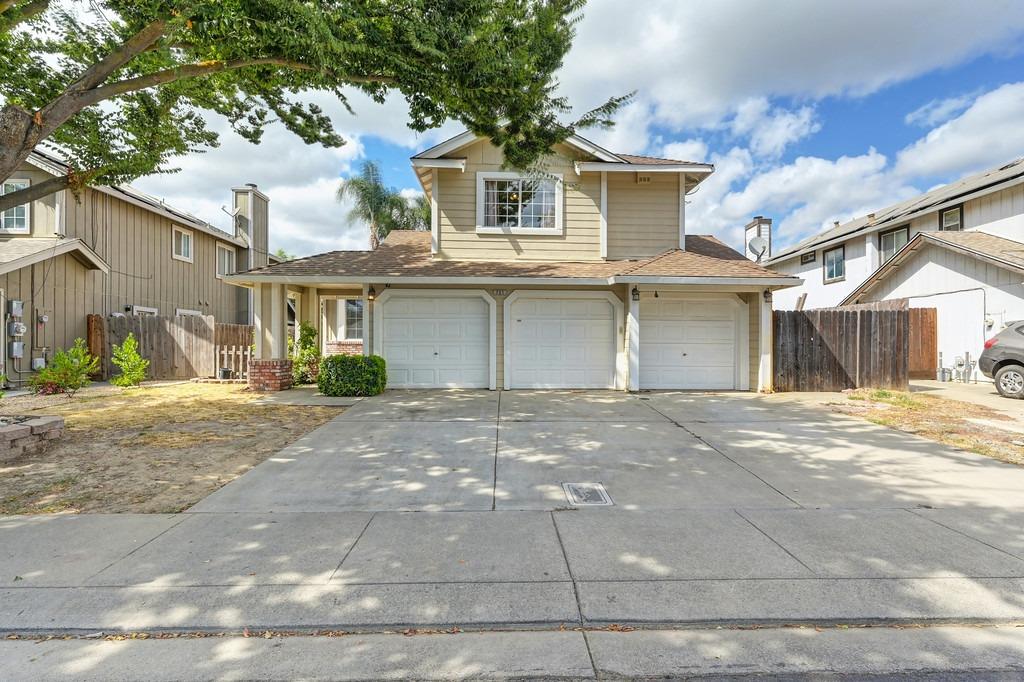 a front view of a house with a garage