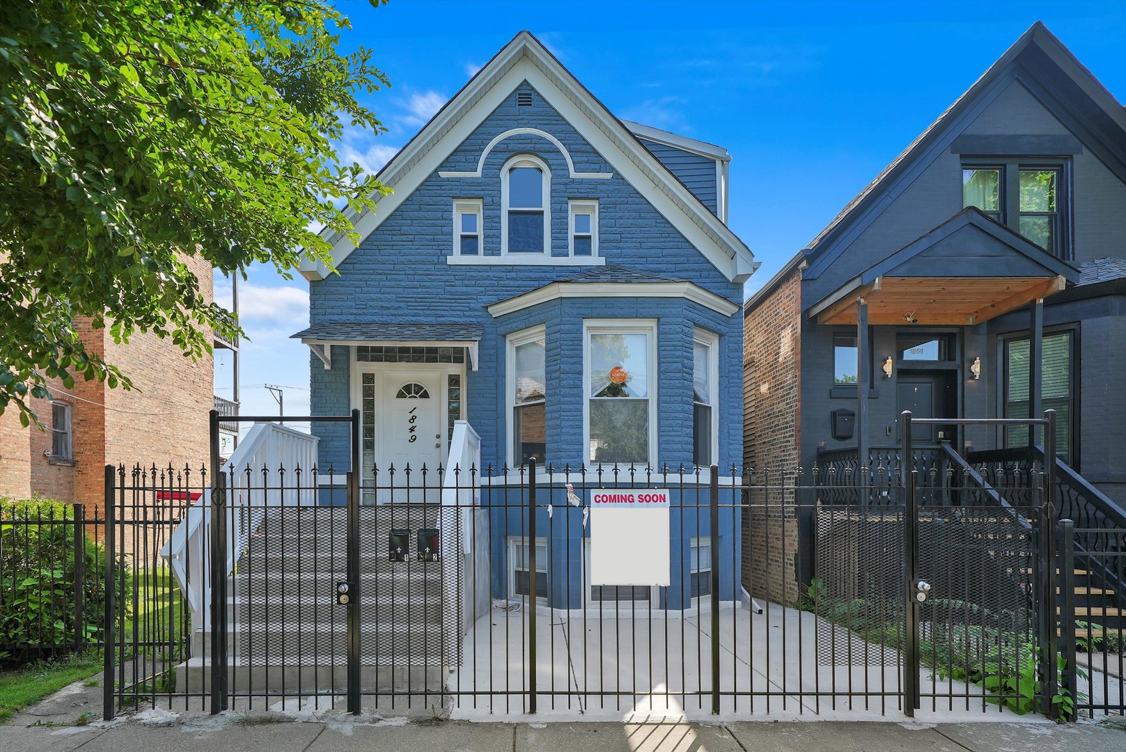 a front view of a house with parking