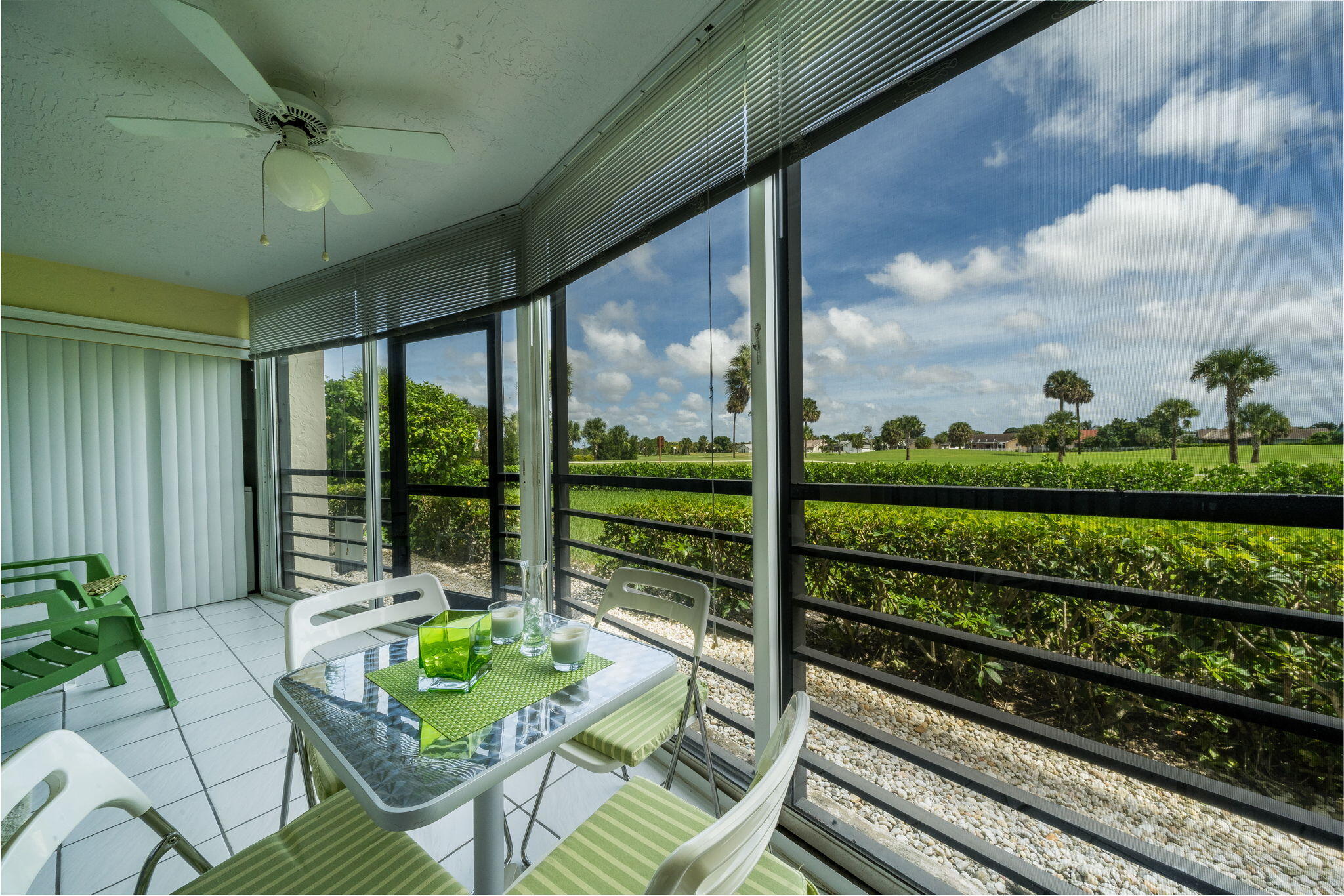 a view of a porch with furniture and garden