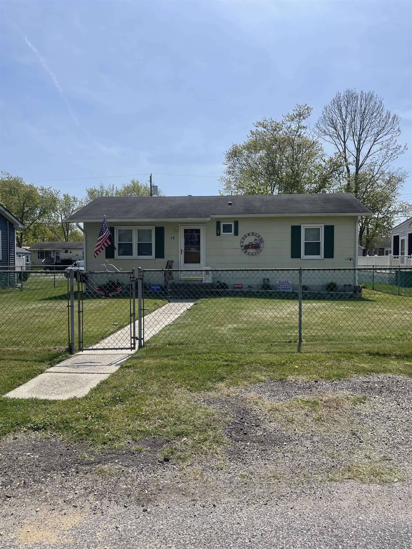 a view of a house with a backyard