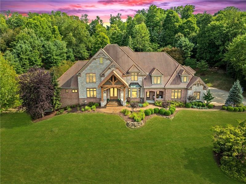 a aerial view of a house with swimming pool and porch