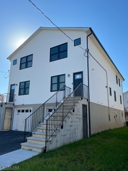 a view of front door and yard