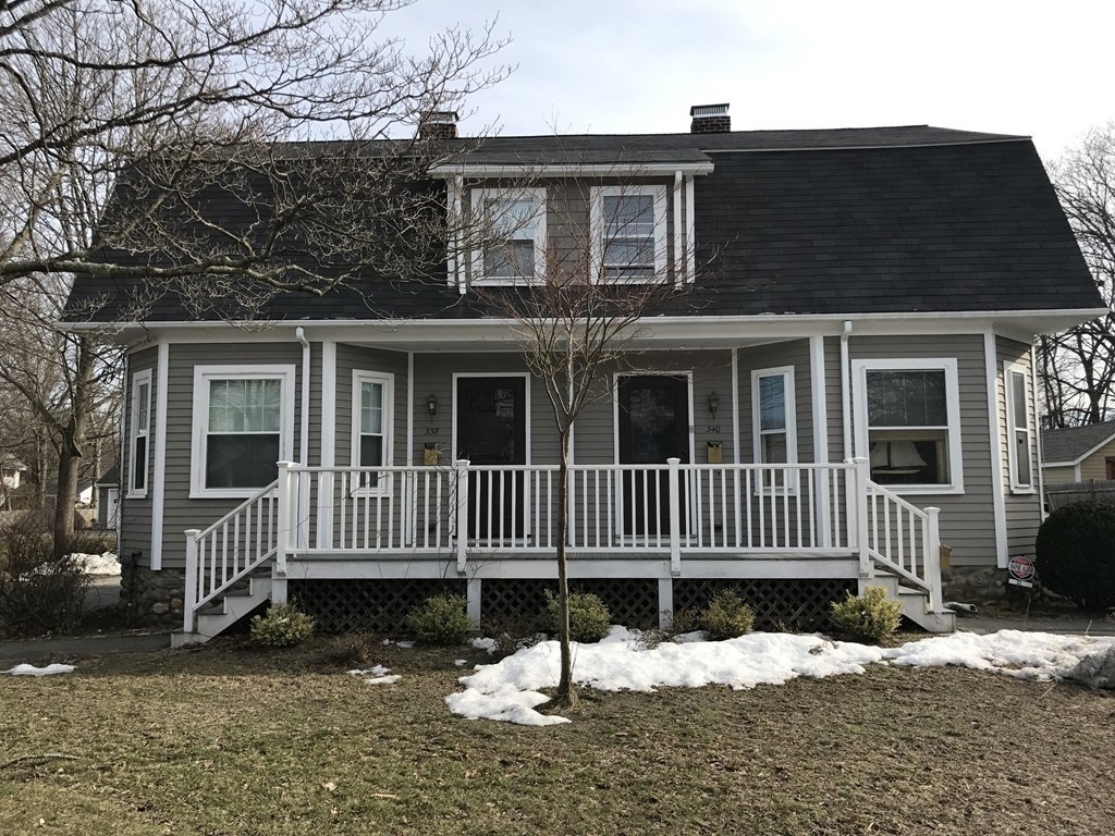 a front view of a house with a fence