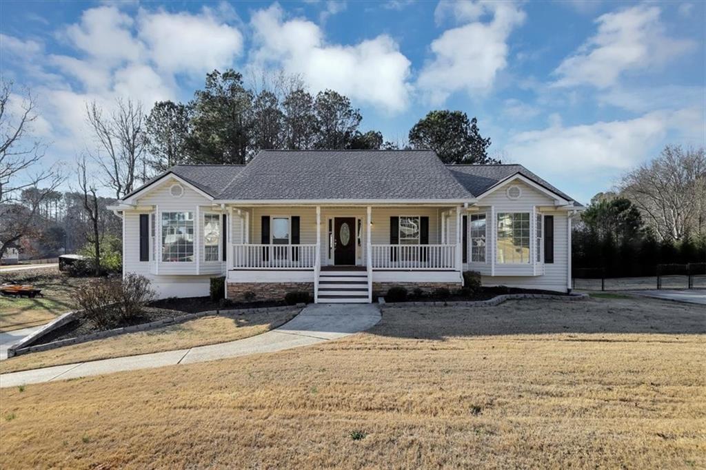 a front view of a house with a yard